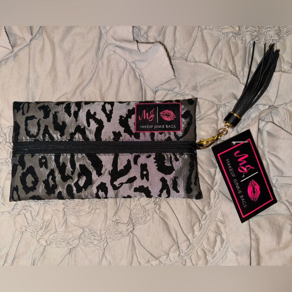 Black and silver cheetah print size small Makeup Junkie bag.
